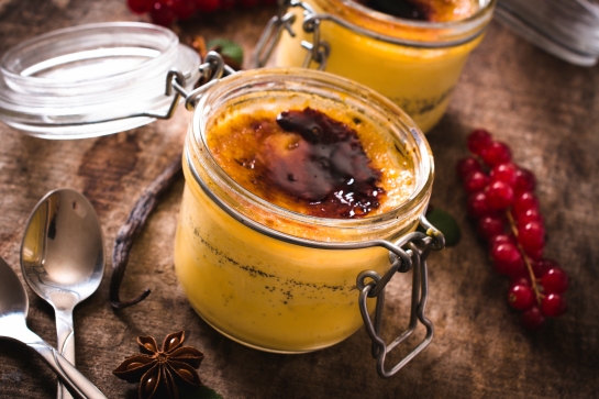 Selective focus on the front jar with traditional French dessert cream brulee